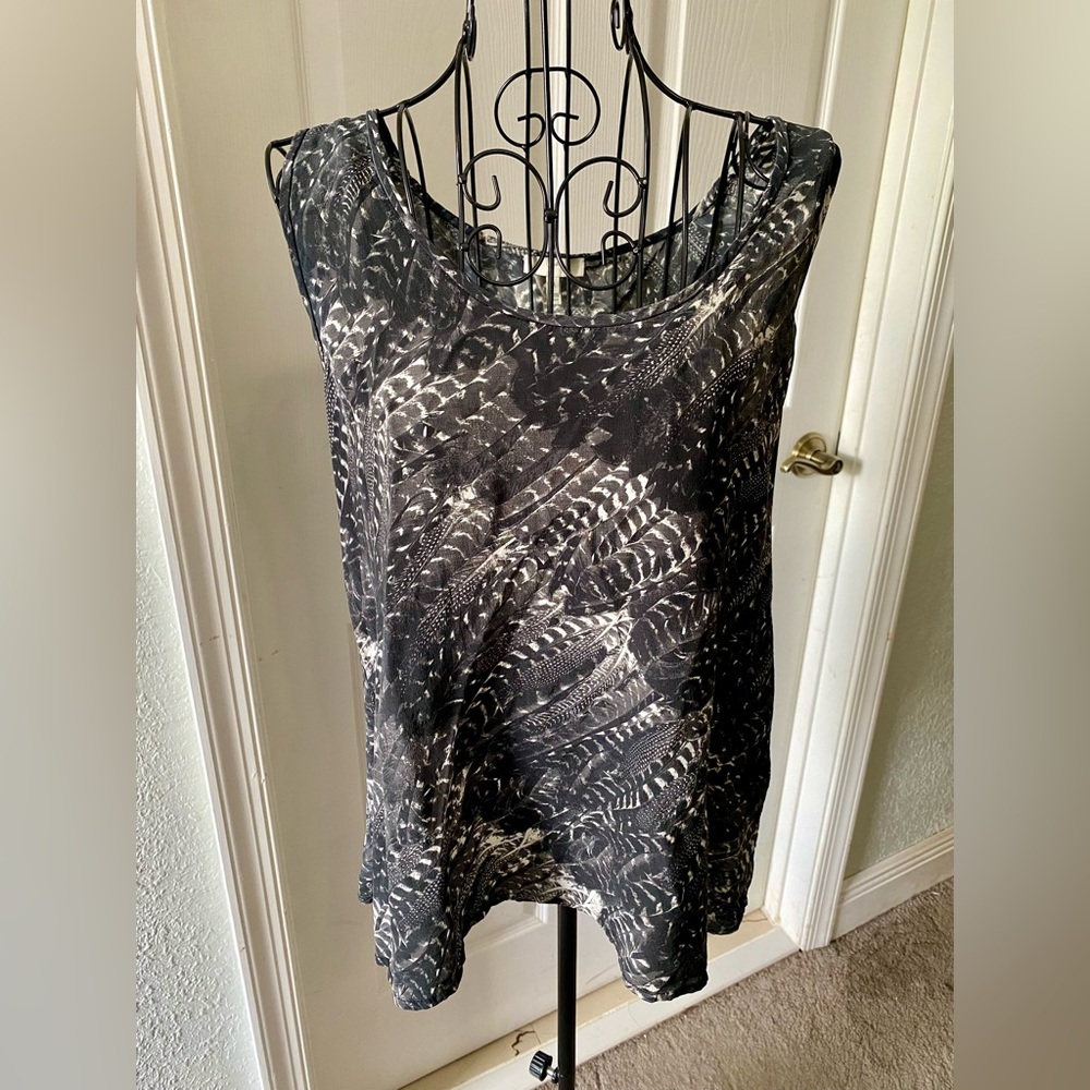 Fly away in this beautiful 100% silk top by Joie!